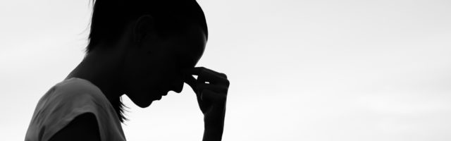 Silhouette of a tired and stressed woman. 