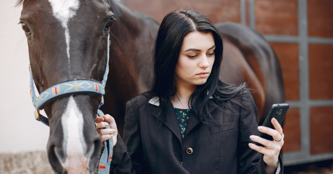 Woman,Standing,With,A,Horse.,Lady,With,A,Mobile,Phon Woman standing with a horse. Lady with a mobile phon 